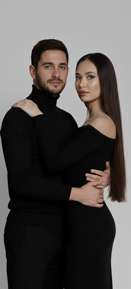 Couple in black posing together